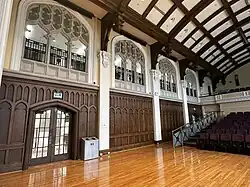 North wall with oak panelling and architectural detail.