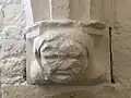 Corbel dating to the late 1200s of a woman wearing a wimple