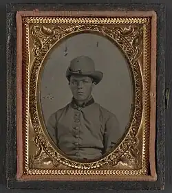 Unidentified soldier in Confederate uniform and Hardee hat