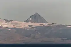 Pogramni (6,569&nbsp;ft; 2,002&nbsp;m) volcano as seen from the Unimak Pass in the morning light.