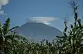 View of Muhabura Volcano in Kinigi sector, Musanze district, Rwanda afar from Volcanoes Park