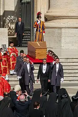 The pope's coffin being carried during the funeral