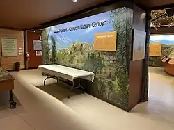 Interior of the nature center, featuring a variety of interactive nature exhibits