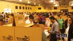 People casting votes inside a polling station