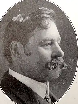 Profile of Victorian man with wide handlebar moustache