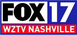 In a blue frame, three boxes. The upper left box is white and contains the Fox network logo in black. The upper right box is blue and contains a silver 17 in a sans serif. Beneath both in a red box is the lettering "W Z T V Nashville" in white in another sans serif.