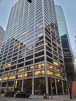 Wall Street Plaza in the early evening, from the intersection of Water and Pine St, March 2025