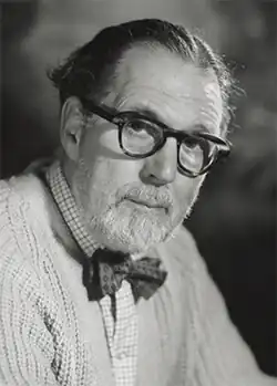 Bird, a man in his sixties, wearing spectacles, a bow tie, and a short, neat beard.