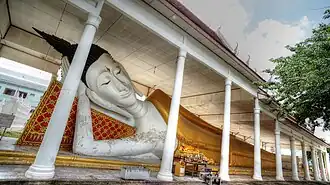 The ancient reclining Buddha statue of Wat Ku