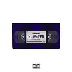 The cover consists of a white background with a purple VHS tape in the center. On the VHS label is the band's name in black as well as the album's name written in purple.