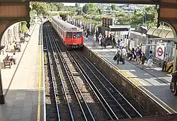 West Brompton underground station platforms, with northbound train arriving (September 2006)