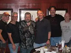 The six members of Western Flyer, gathered at a restaurant