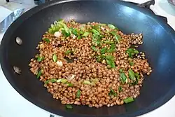 Wheat berries cooking - soaked then sauteed with spring onion