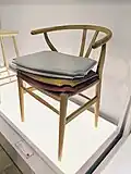 Wishbone Chair with accessory seat covers on display