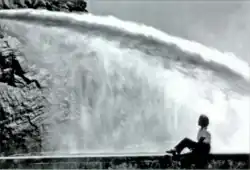 Woman (Gene Segerblom) watching Hoover Dam Needle Test, c. 1938-1941