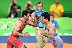 Saman Tahmasebi (red) fought against Iran's Habibollah Akhlaghi