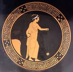Boy playing with a terracotta yo-yo, Attic kylix, c. 440 BC, Antikensammlung Berlin (F 2549)