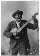 McCrary and Branson photograph of African-American banjo player "Happy John" Woods, date unknown; this image is reproduced on the cover of The Rough Guide to Blues Songsters (Library of Congress collection)