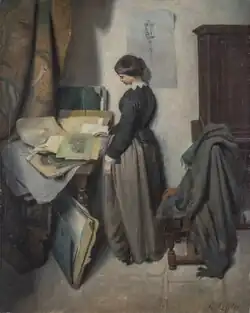 a woman peruses artworks on paper in a folding folio