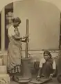 Klingalese women pounding rice in India, around 1890